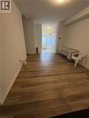 Kitchener townhouse for rent - A room with wooden flooring and white walls.