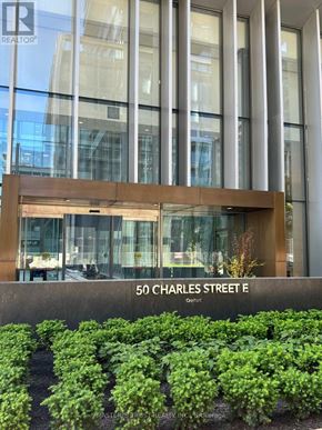 Toronto (Church-Yonge Corridor) condo for rent - A building with a sign that says 50 Charles Street E.