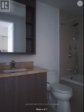 Toronto (Waterfront Communities) condo for rent - A small bathroom with a toilet, sink and shower.