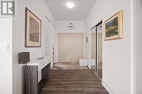 Toronto (Humewood-Cedarvale) condo for rent - A hallway with a rug on the floor and a painting on the wall.
