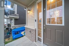 Loyalist (Bath) multi-family for rent - A home real estate photo shows a house with a brown door and a small porch.