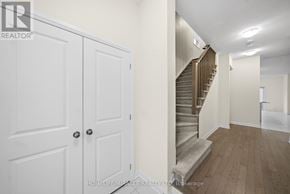 Loyalist (Bath) multi-family for rent - A hallway with a staircase and two doors.