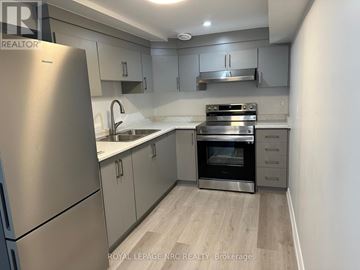 St. Catharines (Vine/Linwell) apartment for rent - A kitchen with a stainless steel refrigerator and oven.