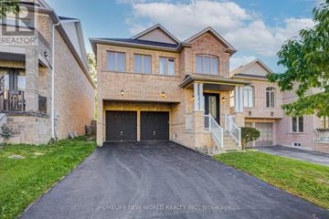 Newmarket (Woodland Hill) apartment for rent - A large brick house with a black garage door is for sale.