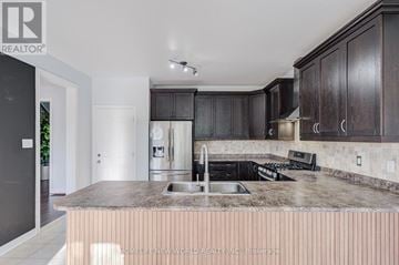 Newmarket (Woodland Hill) apartment for rent - A kitchen with dark wood cabinets and a marble countertop.
