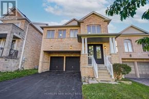 Newmarket (Woodland Hill) apartment for rent - A brick house with a black garage door is for sale.