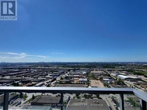 Vaughan (Vaughan Corporate Centre) condo for rent - A view from a high vantage point overlooking a cityscape with a clear blue sky.