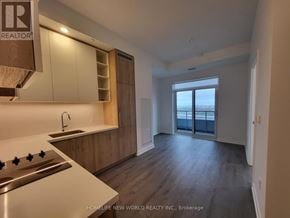 Vaughan (Vaughan Corporate Centre) condo for rent - A kitchen with wooden cabinets and a stainless steel stove top.