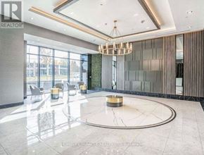 Toronto (Tam O'shanter-Sullivan) condo for rent - A modern lobby with a marble floor and a chandelier.