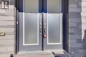 Caledon apartment for rent - A glass door with a silver handle and a red lock.