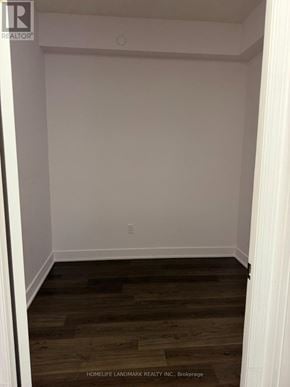 Toronto (Willowdale East) condo for rent - A room with wooden flooring and white walls.