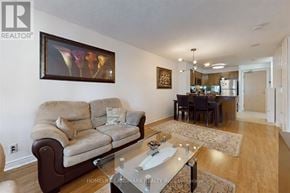 Toronto (Mount Pleasant West) condo for rent - A living room with a couch, a coffee table, and a painting on the wall.