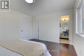 Toronto (Agincourt South-Malvern West) apartment for rent - A bedroom with a bed, two doors, and a small bathroom visible through the doorway.
