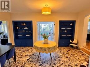 West Vancouver apartment for rent - A living room with a round table in the middle and a rug on the floor.