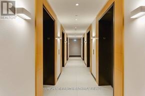 Toronto (Bay Street Corridor) condo for rent - A long hallway with doors on both sides and a light on the wall.