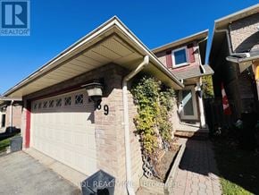 Whitby (Pringle Creek) apartment for rent - A house with a garage numbered 99.