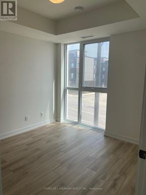 Oakville (Jm Joshua Meadows) condo for rent - A room with a sliding glass door leading to a balcony.