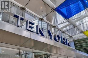 Toronto condo for rent - A sign that says "TENNYORK" is hanging from the ceiling.