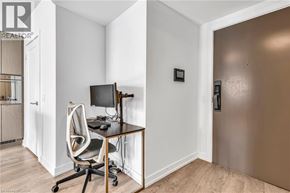 Toronto condo for rent - A room with a desk and a computer monitor.