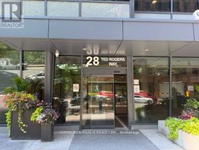 Toronto (Church-Yonge Corridor) condo for rent - The front of a realtor office with a sign that says 28 Ted Rogers Way.