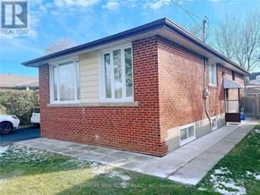 Richmond Hill (Crosby) apartment for rent - A red brick house with a white car parked in front.
