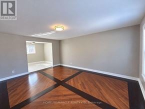 Brampton (Brampton South) apartment for rent - A room with wooden flooring and a ceiling light.