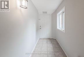 Ottawa apartment for rent - A hallway with a door and a window.