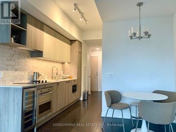 Toronto (Humewood-Cedarvale) condo for rent - A modern kitchen with a dining area.