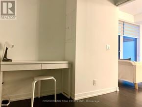 Toronto (Humewood-Cedarvale) condo for rent - A white desk with a white chair in a room with white walls.