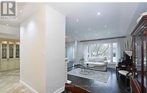 Richmond Hill (Mill Pond) apartment for rent - A living room with a white couch and a piano.