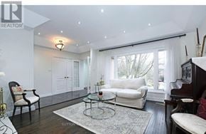 Richmond Hill (Mill Pond) apartment for rent - A living room with a black coffee table and a white sofa.