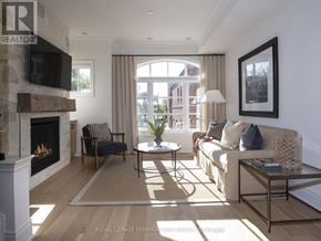 Toronto (Rockcliffe-Smythe) townhouse for rent - A living room with a fireplace and a couch.