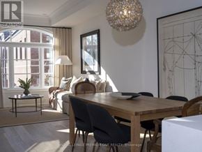 Toronto (Rockcliffe-Smythe) townhouse for rent - A dining room with a wooden table and chairs.