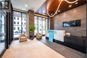 Kitchener condo for rent - A reception area with a sign that says "TEK" on the wall.