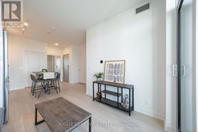 Vaughan (Brownridge) condo for rent - A living room with a dining table and chairs.