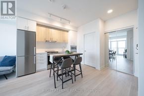 Vaughan (Brownridge) condo for rent - A modern kitchen with a dining table and chairs.