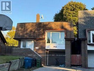 Toronto (Hillcrest Village) apartment for rent - A house with a brown roof and a sign that says "REALTOR" in the foreground.