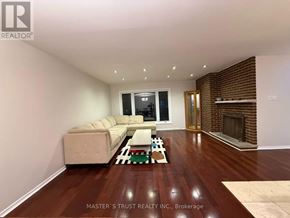 Toronto (Hillcrest Village) apartment for rent - A living room with a couch and a fireplace.