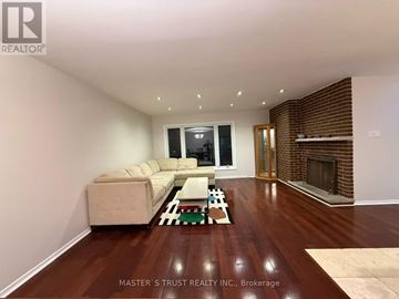 Toronto (Hillcrest Village) apartment for rent - A living room with a couch and a fireplace.