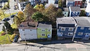 St. John's apartment for rent - A street view of a residential area with houses and cars.