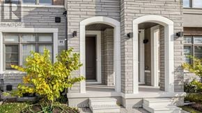 Vaughan (Vellore Village) townhouse for rent - A house with a grey facade and a white door.