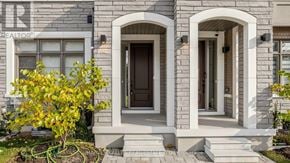Vaughan (Vellore Village) townhouse for rent - A house with a stone facade and a brown door.