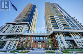Vaughan (Vaughan Corporate Centre) condo for rent - Two tall buildings with balconies and a sign that says "REALTOR" in the sky.