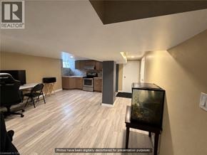 Hamilton apartment for rent - A living room with a television and a fish tank.