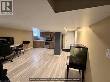 Hamilton apartment for rent - A living room with a television and a fish tank.