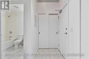 Toronto (Waterfront Communities) condo for rent - A white bathroom with a toilet, sink, and shower.
