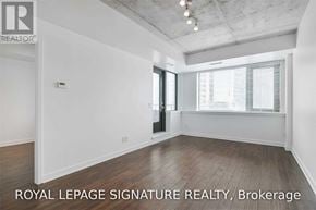 Toronto (Waterfront Communities) condo for rent - A white room with a door and a window with blinds.