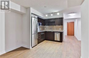 Toronto (Agincourt South-Malvern West) condo for rent - A kitchen with a refrigerator, oven, and dishwasher.
