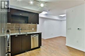 Toronto (Agincourt South-Malvern West) condo for rent - A kitchen area with a refrigerator, sink, and cabinets.