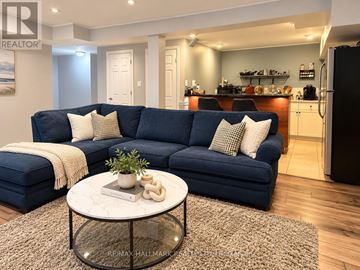 Toronto (Centennial Scarborough) apartment for rent - A living room with a blue couch and a coffee table.